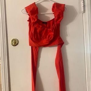Red blouse that ties in the back